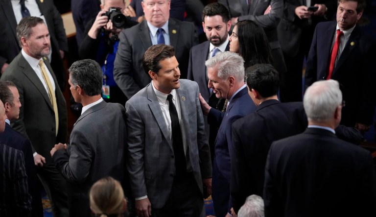 Rep. Kevin McCarthy (R-CA) talks with Rep. Matt Gaetz (R-FL) during voting on a motion to adjourn after the 14th round of voting as the House meets for the fourth day to try and elect a speaker and convene the 118th Congress in Washington, Friday, Jan. 6, 2023. At right is Rep. Patrick McHenry (R-NC). 