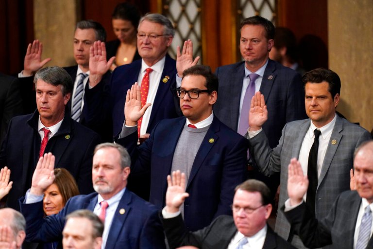 Rep. George Santos, R-N.Y., and Rep. Matt Gaetz, R-Fla., are sworn in by Speaker of the House Kevin McCarthy of Calif., as members of the 118th Congress in Washington, early Saturday, Jan. 7, 2023.