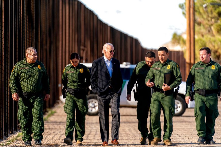 President Joe Biden talks with U.S. Border Patrol agents as they walk along a stretch of the U.S.-Mexico border in El Paso, Texas, Sunday, Jan. 8, 2023.