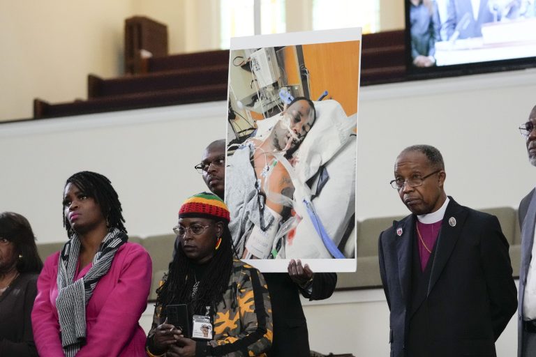 Family members and supporters hold a photograph of Tyre Nichols, who died after being beaten by Memphis police officers, at a news conference with civil rights Attorney Ben Crump in Memphis, Tenn., Monday, Jan. 23, 2023.