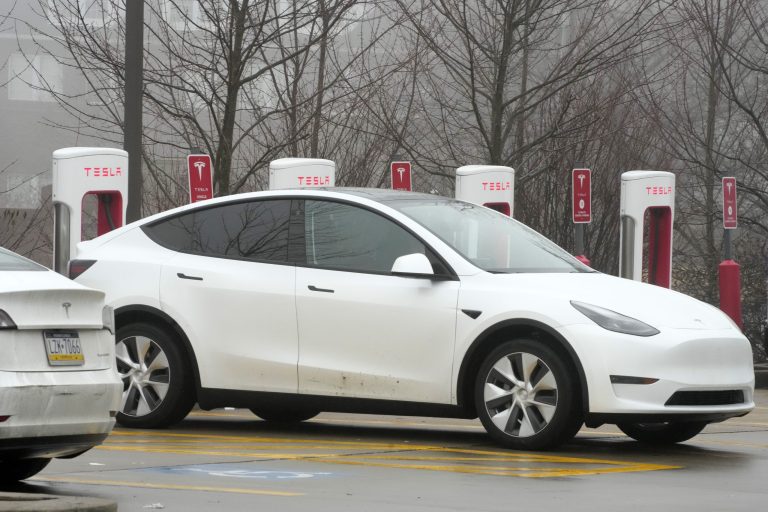 A Tesla is charged at a Tesla charging station in Pittsburgh on Monday, Jan. 30, 2023. 