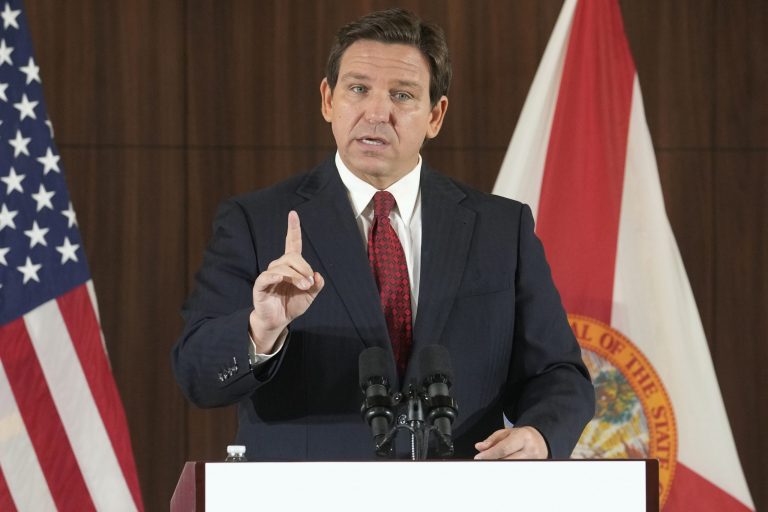 Florida Gov. Ron DeSantis gestures during a news conference, Jan. 26, 2023, in Miami. 
