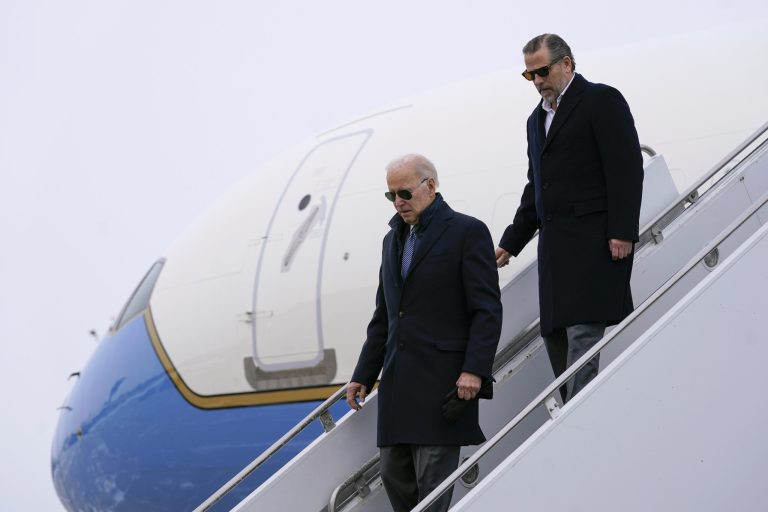 President Joe Biden and his son, Hunter Biden, step off Air Force One, Saturday, Feb. 4, 2023, at Hancock Field Air National Guard Base in Syracuse, N.Y. The Bidens are in Syracuse to visit with family members following the passing of Michael Hunter, the brother of the president's first wife, Neilia Hunter Biden.