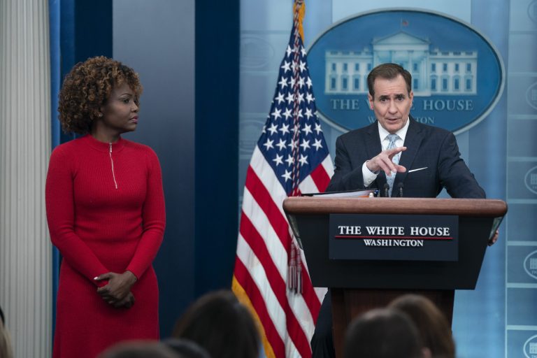 White House press secretary Karine Jean-Pierre listens as National Security Council spokesman John Kirby speaks during a press briefing at the White House, Monday, Feb. 13, 2023, in Washington.