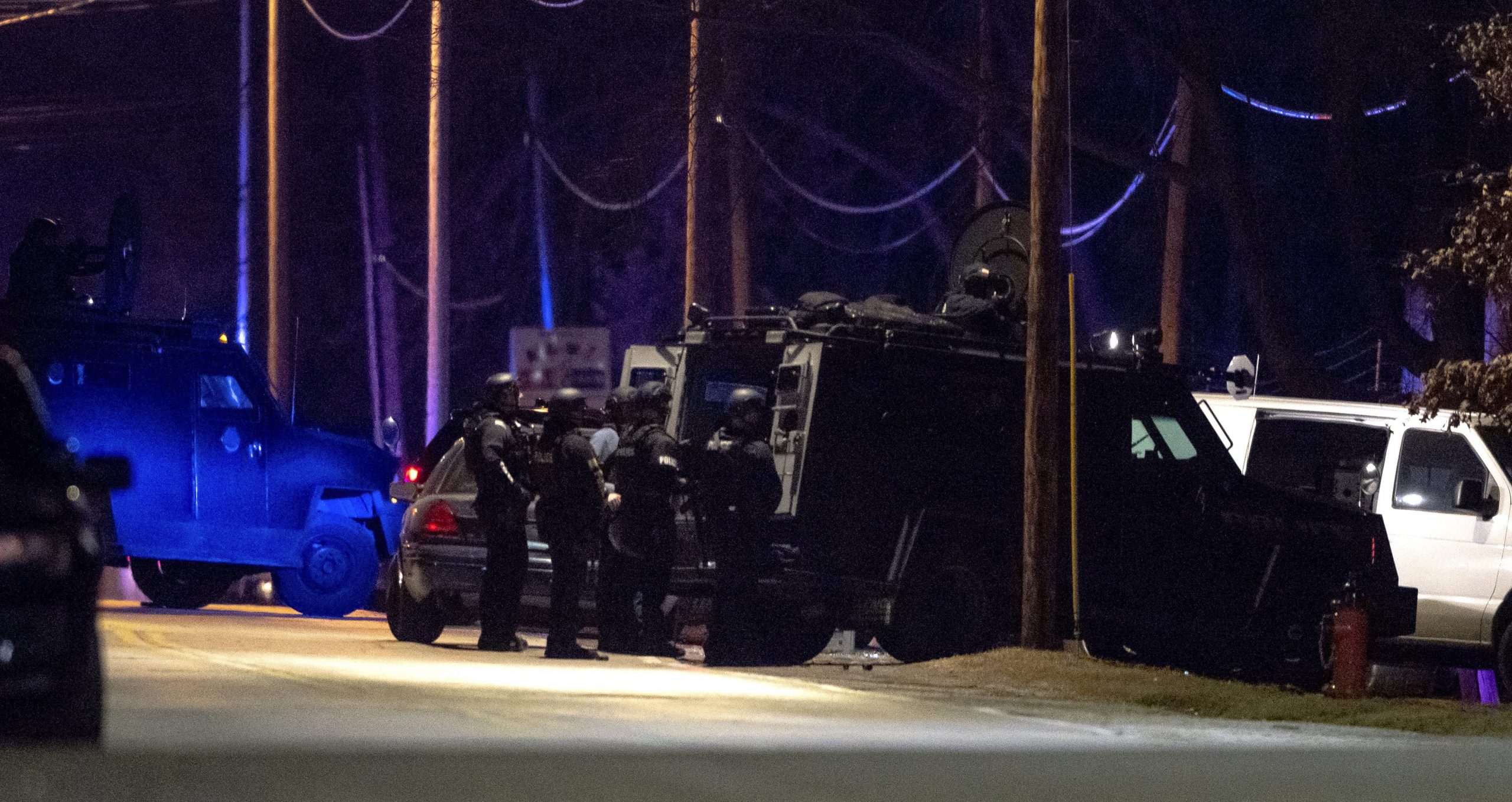 Kansas City standoff ends with one dead, three officers shot, and woman in custody