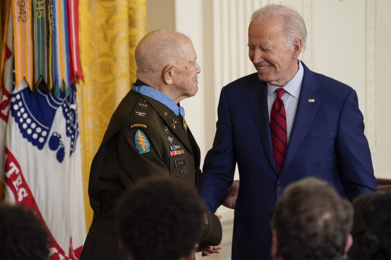 President Joe Biden shakes hands with retired Army Col. Paris Davis after awarding Davis the Medal of Honor for his heroism during the Vietnam War, in the East Room of the White House, Friday, March 3, 2023, in Washington. Davis, then a captain and commander with the 5th Special Forces Group, engaged in nearly continuous combat during a pre-dawn raid on a North Vietnamese army camp in the village of Bong Son in Binh Dinh province.