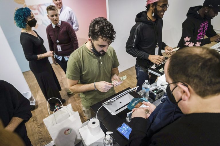 A customer purchases cannabis products at the Housing Works Cannabis Co., New York's first legal cannabis dispensary, on Dec. 29, 2022, in New York. New York authorities would be given expanded power to shut down illegal pot shops and to levy fines of up to $200,000 under legislation proposed Wednesday, March 22, 2023, by Gov. Kathy Hochul to protect the state's fledgling legal recreational marijuana market. 