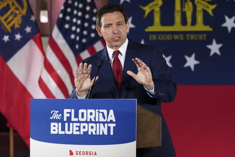 Florida Gov. Ron DeSantis speaks to a crowd at Adventure Outdoors gun store, Thursday, March 30, 2023, in Smyrna, Georgia.