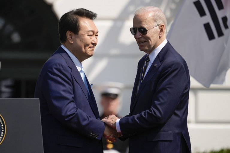 President Joe Biden and South Korea's President Yoon Suk Yeol shake hands during a State Arrival Ceremony on the South Lawn of the White House Wednesday, April 26, 2023, in Washington.