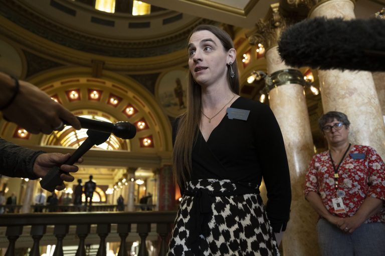Rep. Zooey Zephyr talks with the media after a House of Representatives session at the Montana State Capitol in Helena, Mont., on Wednesday, April 26, 2023.