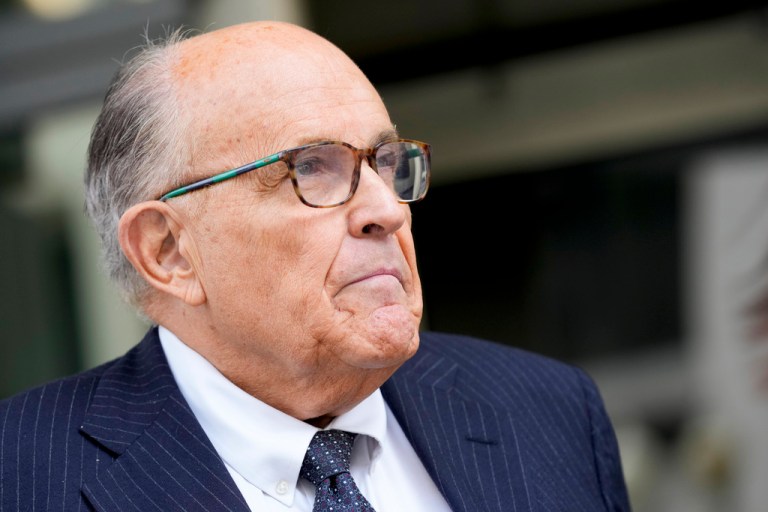 Rudy Giuliani speaks with reporters as he departs the federal courthouse, Friday, May 19, 2023, in Washington. 