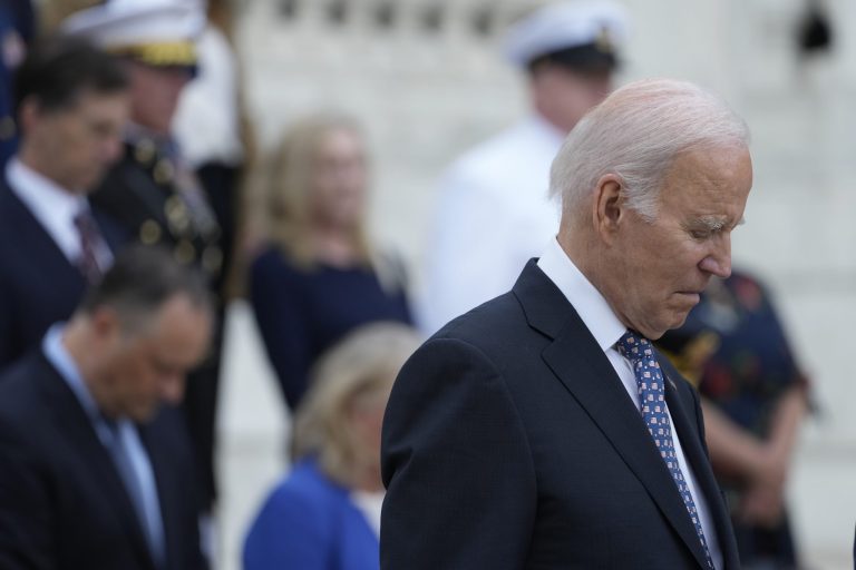 President Joe Biden bows his head after laying a wreath at The Tomb of the Unknown Soldier at Arlington National Cemetery in Arlington, Va., on Memorial Day, Monday, May 29, 2023. 