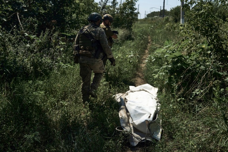 Ukrainian soldiers walk on the frontline near Bakhmut, Donetsk region, Ukraine, Tuesday, July 4 2023. 