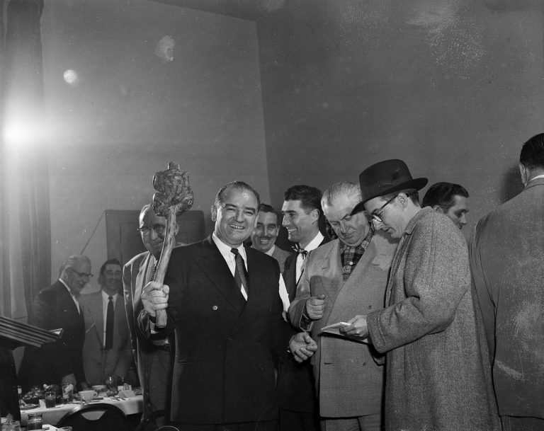 Sen. Joseph McCarthy (R-Wisc.) brandishes a shillelagh for the benefit of photographers on arriving in Manitowoc, Wisc., March 13, 1954, to address the Manitowoc Junior Chamber of Commerce. A CNN analyst has compared GOP leaders to those during McCarthy's days for their silence in challenging President Trump's voter fraud claims.