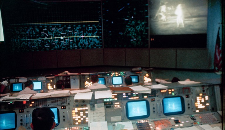 In this July 20, 1969 photo made available by NASA, flight controllers work in the Mission Operations Control Room in the Mission Control Center during the Apollo 11 lunar extravehicular activity.