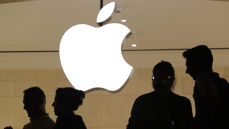 In this May 31, 2018, file photo, customers enter the Apple store in New York. 