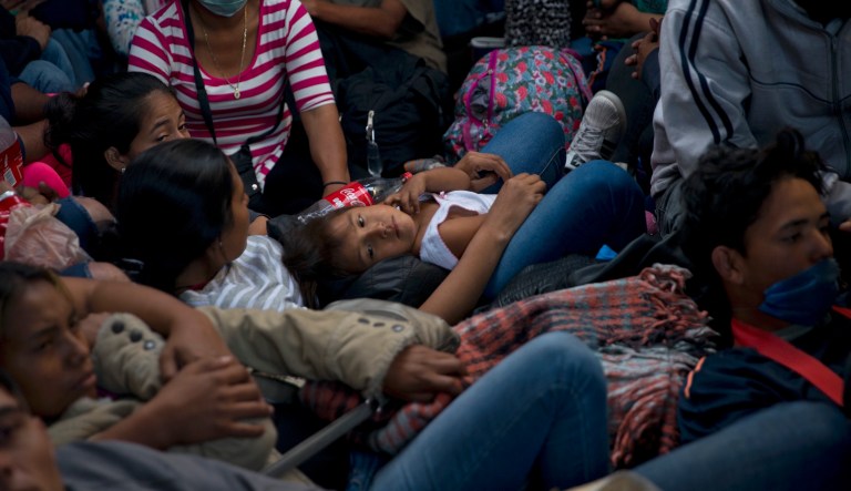 Migrants travel in a truck from Mexicali to Tijuana, part of the migrant caravan, in Mexico, Tuesday, Nov. 27, 2018.