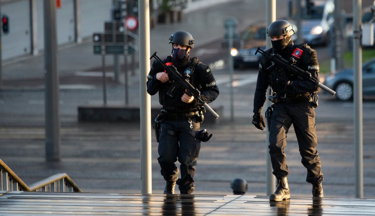 Police patrol during the trial of four persons, including an Iranian diplomat and Belgian-Iranian couple at the courthouse in Antwerp, Belgium, Thursday, Feb. 4, 2021. An Iranian official on Thursday was convicted of masterminding a thwarted bomb attack against an exiled Iranian opposition group in France in 2018 and sentenced to 20 years in prison by a Belgian court that rejected his claim of diplomatic immunity.