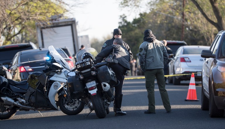 Authorities are investigating the scene in East Austin, Texas, after a teenager was killed and a woman was injured in the second Austin package explosion in the past two weeks Monday, March 12, 2018. Authorities say a package that exploded inside of an Austin home on Monday is believed to be linked to a deadly package sent to another home in Texas' capital city earlier this month.