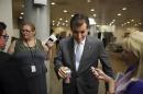 U.S. Senator Ted Cruz (R-TX) (C) talks with a reporter after the weekly Republican caucus luncheon at the U.S. Capitol in Washington, June 25, 2013. REUTERS/Jonathan Ernst