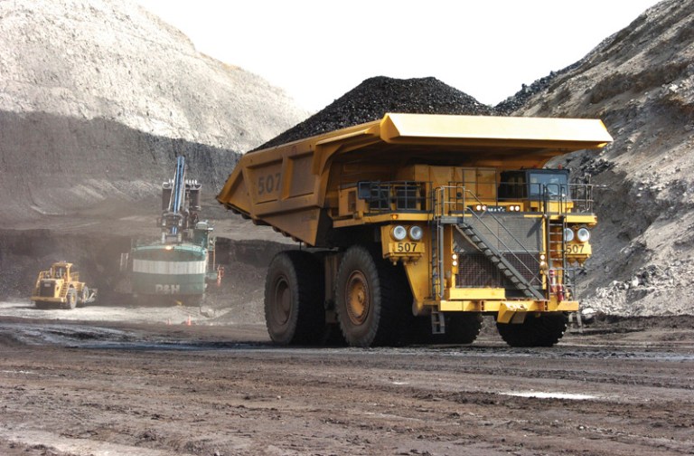 A truck carrying 250 tons of coal hauls the fuel to the surface of the Spring Creek mine near Decker, Mont. (AP Photo/Matthew Brown)