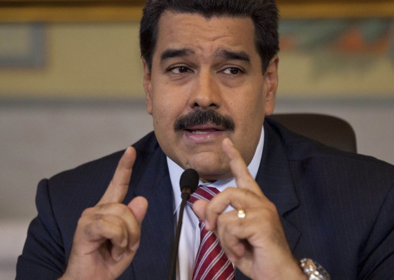 Venezuela's President Nicolas Maduro gives a press conference at Miraflores presidential palace in Caracas, Venezuela, Wednesday, Oct. 15, 2014. (AP Photo/Ariana Cubillos)