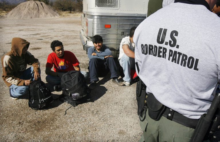 U.S. Border Patrol detains a large group of suspected immigrants at the Arizona-Mexico border in Sasabe, Ariz. (AP Photo/Ross D. Franklin)