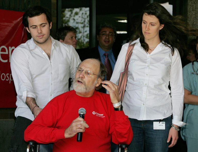 FILE - In this April 30, 2007, file photo, son Jeffrey Corzine, left, and daughter Jennifer Corzine-Pisani, listen as New Jersey Gov. Jon S. Corzine addresses the media outside Cooper University Hospital in Camden, N.J., as he was released after being hospitalized for serious injuries in an automobile accident on April 12. A spokesman for the former governor announced on Thursday, March 13, 2014, that Jeffrey Corzine had died at age 31. There were no other details available. (AP Photo/Mel Evans, File)