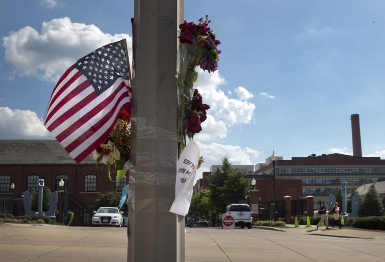 A makeshift memorial hangs on a lamp post across the street from the Washington Navy Yard on Friday. (AP/Carolyn Kaster)
