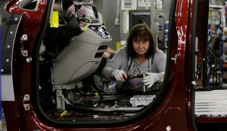 Rosa Labonte works on a 2017 Chrysler Pacifica on the assembly line at the Windsor Assembly Plant, Friday, May 6, 2016 in Windsor. NAFTA's rules of origin are particularly important to automakers, who use supply chains spread across all three member countries. (AP Photo/Carlos Osorio)