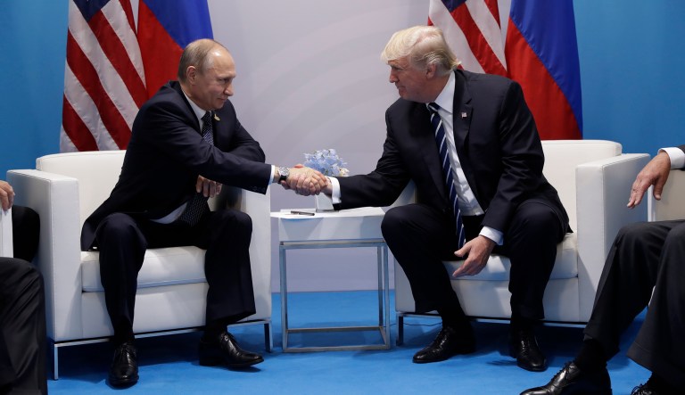 President Trump shakes hands with Russian President Vladimir Putin at the G-20 summit in Hamburg in July 2017. "Putin and I have been discussing various things, and I think it has gone very well," Trump said.