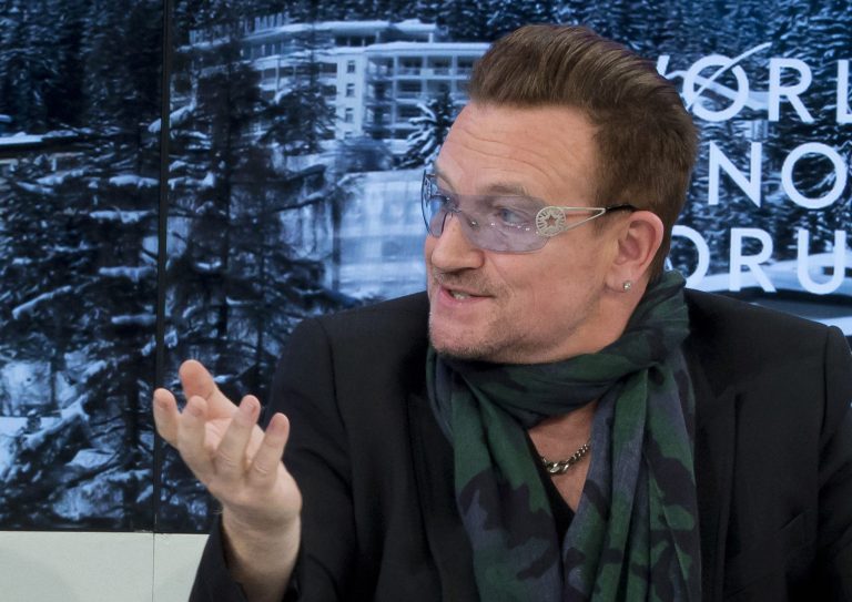 Rock star Bono speaks during a panel discussion  
