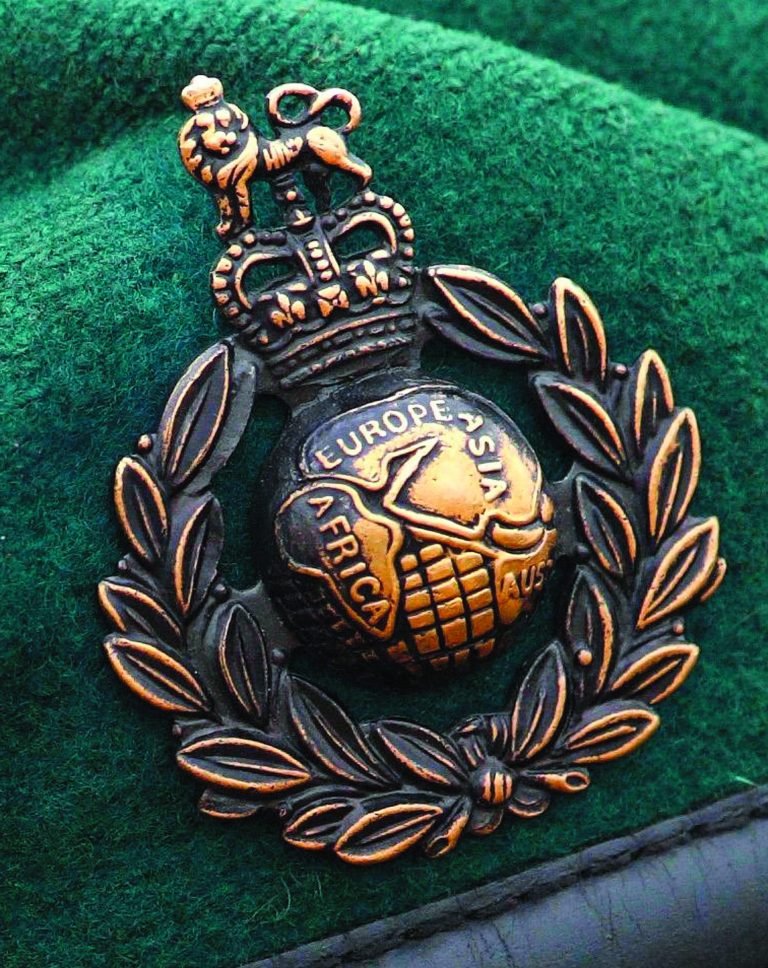 FILE - In this Jan. 21, 2010 file photo a Royal Marines Commando cap badge is seen. Five Royal Marines have been charged with murder over a death in Afghanistan last year, Britain's Ministry of Defense said Sunday Oct. 14, 2012. They are the first British troops to be charged with murder in the country since deployments began in 2001. (AP Photo/PA, Chris Ison, file) UNITED KINGDOM OUT NO SALES NO ARCHIVE