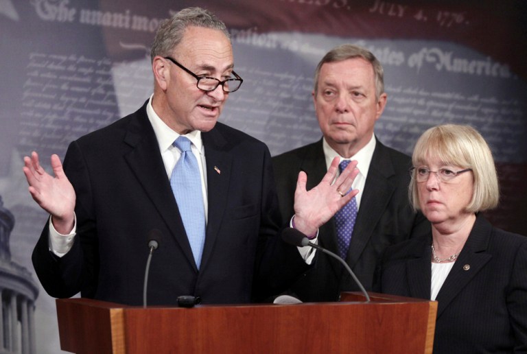 Sen. Charles Schumer, D-N.Y., left, accompanied by Whip Dick Durbin of Ill., and Sen. Patty Murray, D-Wash., speaks during a news conference on Capitol Hill in Washington to discuss immigration reform. (AP Photo/Lauren Victoria Burke)