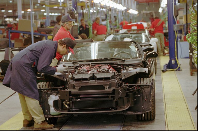 Chrysler Corp. employees work on 1996 Dodge Vipers on the first day of production at the new Conner Avenue Assembly Plant in Detroit on Friday, Oct. 27, 1995. (AP Photo/Richard Sheinwald)