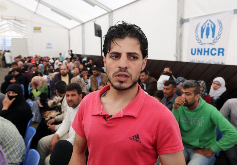 Syrian refugee Yahya, speaks to journalists at the United Nations High Commissioner for Refugees (UNHCR) registration center in the northern city of Tripoli, Lebanon, Thursday, April 3, 2014. The teenager from central Syria became the one millionth Syrian refugee to register in Lebanon on Thursday, a 