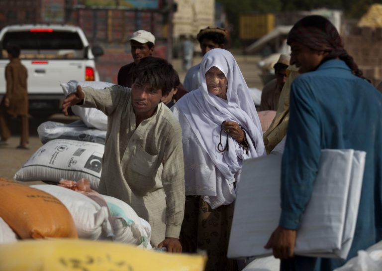 In this Friday, June 27, 2014 photo, Pakistanis flee their villages after receiving relief supplies at a distribution point in Bannu, North Waziristan. Pakistan launched a ground offensive against Taliban strongholds near the Afghan border Monday after evacuating nearly half a million residents from the tribal region, the army said. (AP Photo/B.K. Bangash)