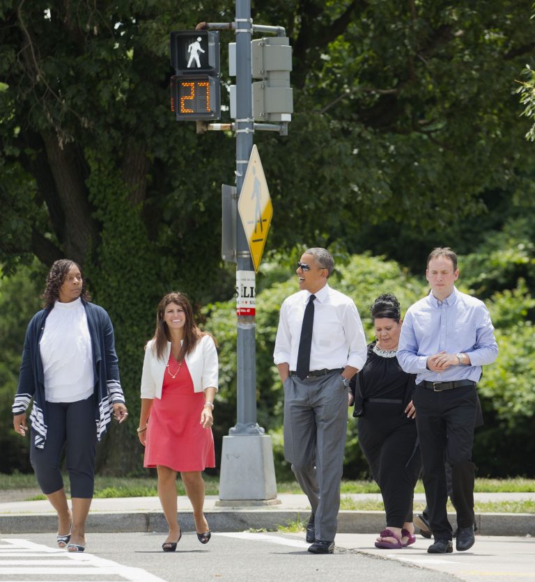 President Barack Obama crosses the street as he walks to have lunch at a Chipotle Mexican Grill in Washington, Monday, June 23, 2014, prior to attending the White House Summit on Working Families. Walking with Obama, from left are, Shirley Young, Lisa Rumain, Shelby Ramirez,  and Rodger Trombley. Obama is encouraging more employers to adopt family-friendly policies, part of a broader effort to convince employers that providing more flexibility is good for business as well as workers. (AP Photo/Pablo Martinez Monsivais)