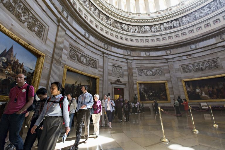 With hours to go until a possible government shutdown, visitors tour the Rotunda of the Capitol in Washington on Monday. (AP/J. Scott Applewhite)