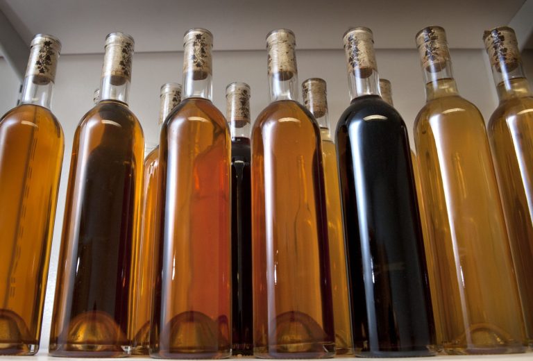 This Aug. 25, 2014 photo shows bottles of "Queen Bee," a traditional style of mead aged in oak barrels, at Arktos Meadery in Grand Rapids, Mich. Maciej Halaczkiewicz, a former nuclear submarine technician from Oak Park, began distributing initial bottle shipments last week from his new venture Arktos. The alcohol-by-volume percentage of Arktos meads is high compared to typical meads available on Michigan taps and store shelves, which generally clock in around 5 percent to 10 percent. Queen Bee hits 15 percent and that's not even the strongest variety Halaczkiewicz is making. (AP Photo/The Grand Rapids Press, Chris Clark) ALL LOCAL TELEVISION OUT; LOCAL TELEVISION INTERNET OUT