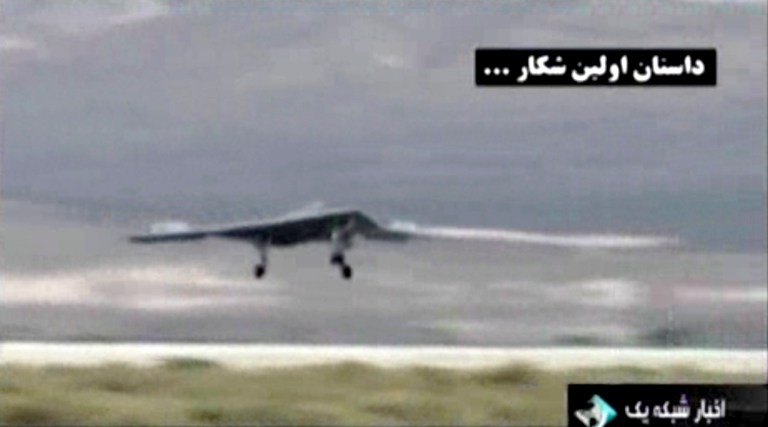 This undated image taken from video broadcast on Iranian state television purports to show a U.S. drone landing in Kandahar, Afghanistan.  Iran's state TV has broadcast footage on Thursday, Feb. 7, 2013, allegedly extracted from the advanced CIA spy drone captured in 2011, the latest in a flurry of moves from Iranian authorities meant to underline the nation's purported military and technological advances. (AP Photo/Iranian state TV via AP video)
