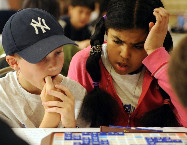Charlie Williamson, left, and Lily Gasperetti, right, both fifth graders from Janney Elementary School in Washington, D.C., struggle to come up with a word while competing at the 2008 National School SCRABBLE Championship, Saturday, May 10, 2008, in Providence, R.I. (AP Photo/Stew Milne)