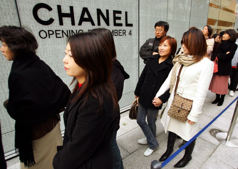 Shipping department workers say Chanel has systematically failed to pay its employees overtime wages. (AP Photo/Itsuo Inouye)