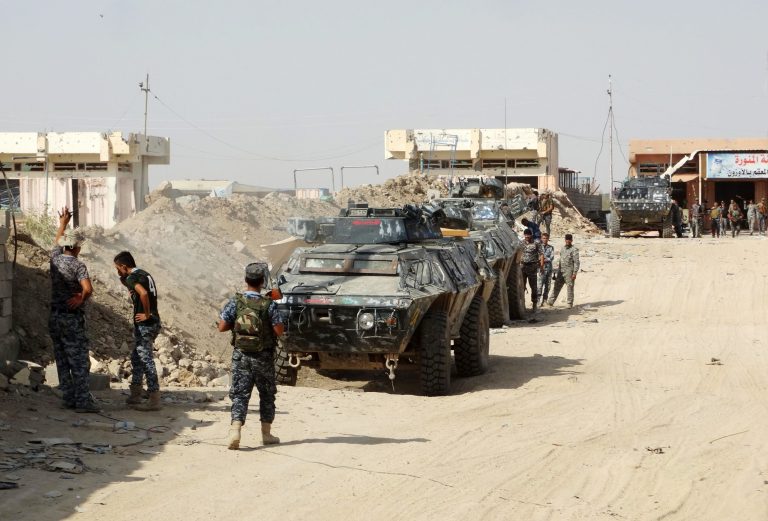 Iraqi security forces, backed by Sunni and Shiite volunteers clash with Islamic State group militants at the front line in the eastern suburbs of Ramadi, Anbar province, Iraq. (AP Photo)