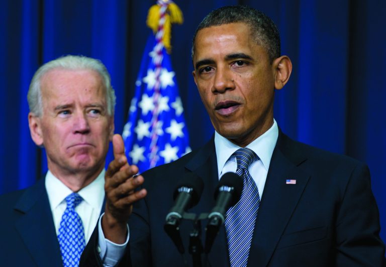 President Barack Obama, accompanied by Vice President Joe Biden, gestures as he talks about proposals to reduce gun violence, Wednesday, Jan. 16, 2013, in the South Court Auditorium at the White House in Washington. (AP Photo/Carolyn Kaster)