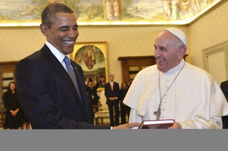 Pope Francis and President Obama smile as they exchange gifts at the Vatican on Thursday. (AP Photo/Gabriel Bouys, Pool)