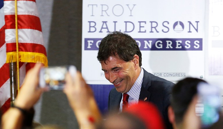 Troy Balderson, Republican candidate for Ohio's 12th Congressional District, shakes hands with a few supporters during an election night party Tuesday, Aug. 7, 2018, in Newark, Ohio.