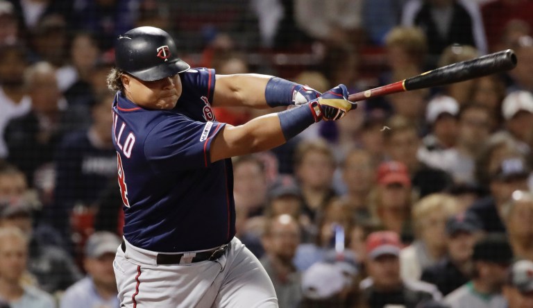 Minnesota Twins pinch-hitter Willians Astudillo hits an RBI single against the Boston Red Sox in the seventh inning of a baseball game at Fenway Park, Thursday, Sept. 5, 2019, in Boston. 