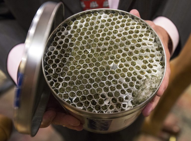 Federal cannabis patient Irvin Rosenfeld displays a tin full of medicalÃÂ marijuana. (AP/PennLive, Joe Hermitt)