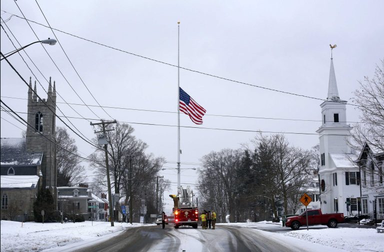 FILE - On the first anniversary of the Sandy Hook massacre, firefighters lower the town's flag on Main Street to half-staff in honor of the victims, in this Saturday, Dec. 14, 2013 file photo, in  Newtown, Conn. The number of shootings in which a gunman wounds or kills multiple people has increased dramatically in recent years, with the majority of attacks in the last decade occurring at a business or a school, according to an FBI report released Wednesday Sept. 24, 2014. According to the report, an average of six shooting incidents occurred in the first seven years that were studied. That average rose to more than 16 per year in the last seven years of the study. That period included the 2012 shootings at a movie theater in Aurora, Colorado and at Sandy Hook Elementary School in Newtown, Connecticut, as well as last year's massacre at the Washington Navy Yard in which a gunman killed 12 people before dying in a police shootout. (AP Photo/Robert F. Bukaty)